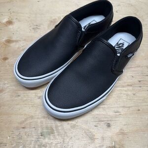 Vans Black and White Canvas Slip-On Sneakers
